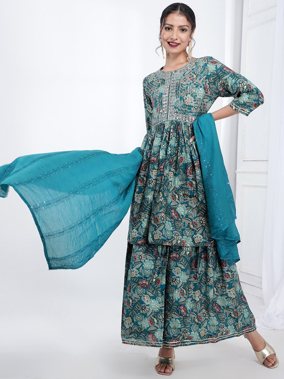 

Bani Women Floral Printed Mirror Work Detailed Liva A-Line Kurta & Sharara with Dupatta, Turquoise blue
