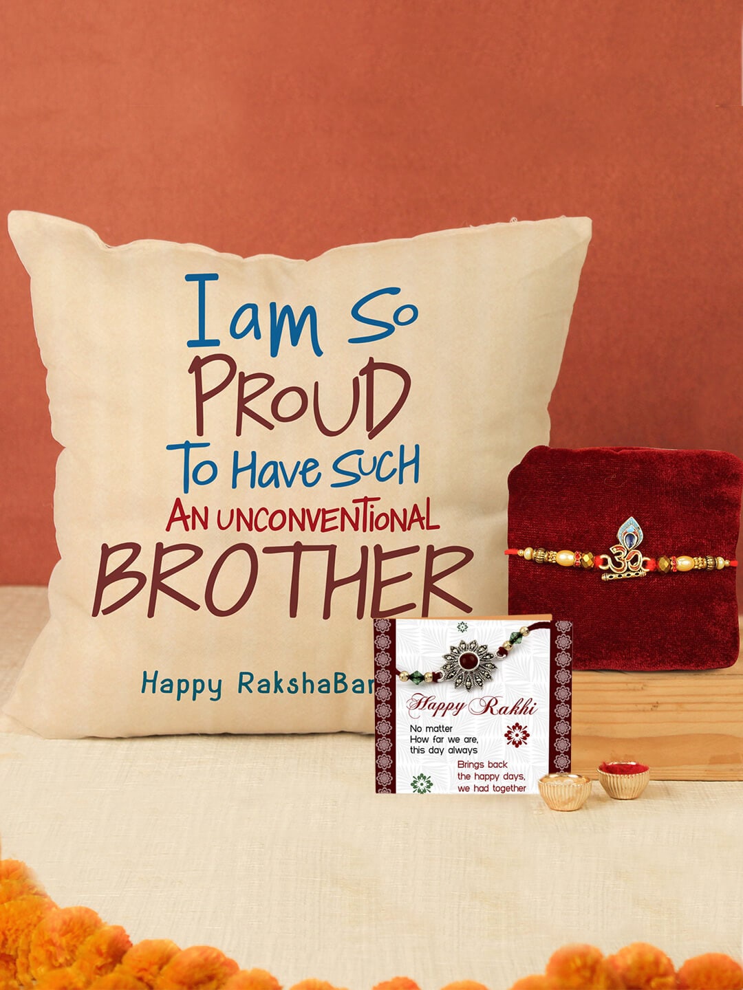 

TIED RIBBONS Unisex Om Charm Detail Rakhi With Cushion Card Roli Chawal Gift Set, Red