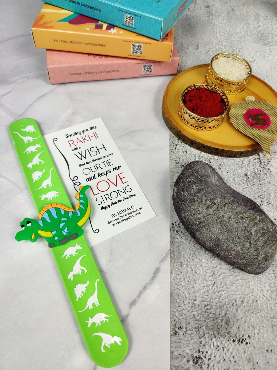 

EL REGALO Kids Dinosaur Design Slap Band Rakhi With Roli Chawal & Greeting Card, Green
