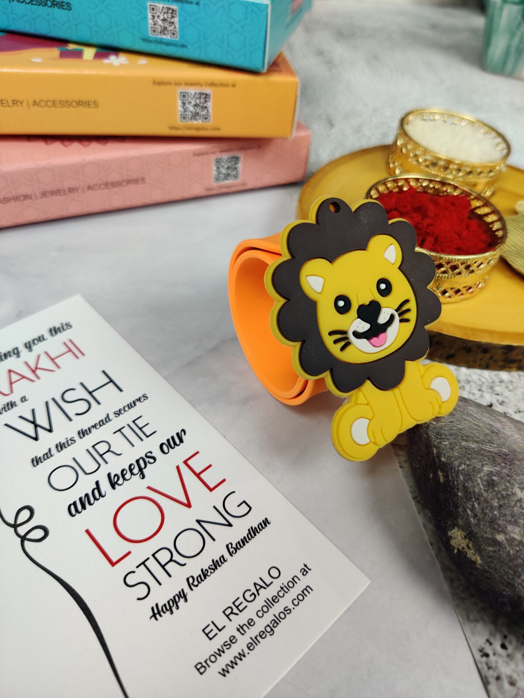 

EL REGALO Kids Lion Design Slap Band Rakhi With Roli Chawl & Card Gift Set, Orange