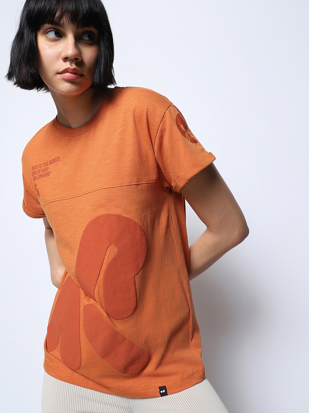 

Bewakoof AIR Orange Typography Printed Drop Shoulder Sleeves Cotton Loose Fit T-Shirt