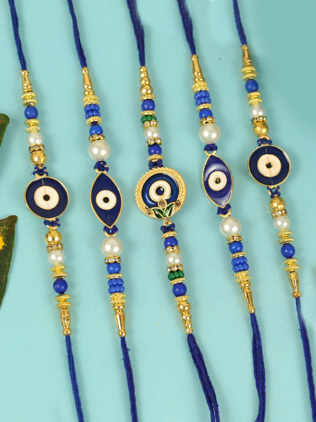 

TIED RIBBONS Unisex Set Of 5 Evil Eye Rakhi & Greeting Card & Roli Rice, Blue