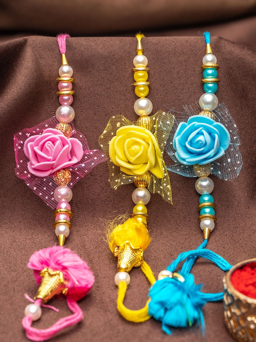 

TIED RIBBONS Unisex Set Of 3 Rakhi With Card & Roli Chawal, Pink