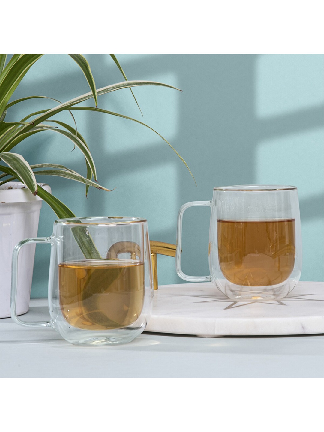 

Anko 2 Pcs Transparent Solid Glass Glossy Mugs - 270 ML