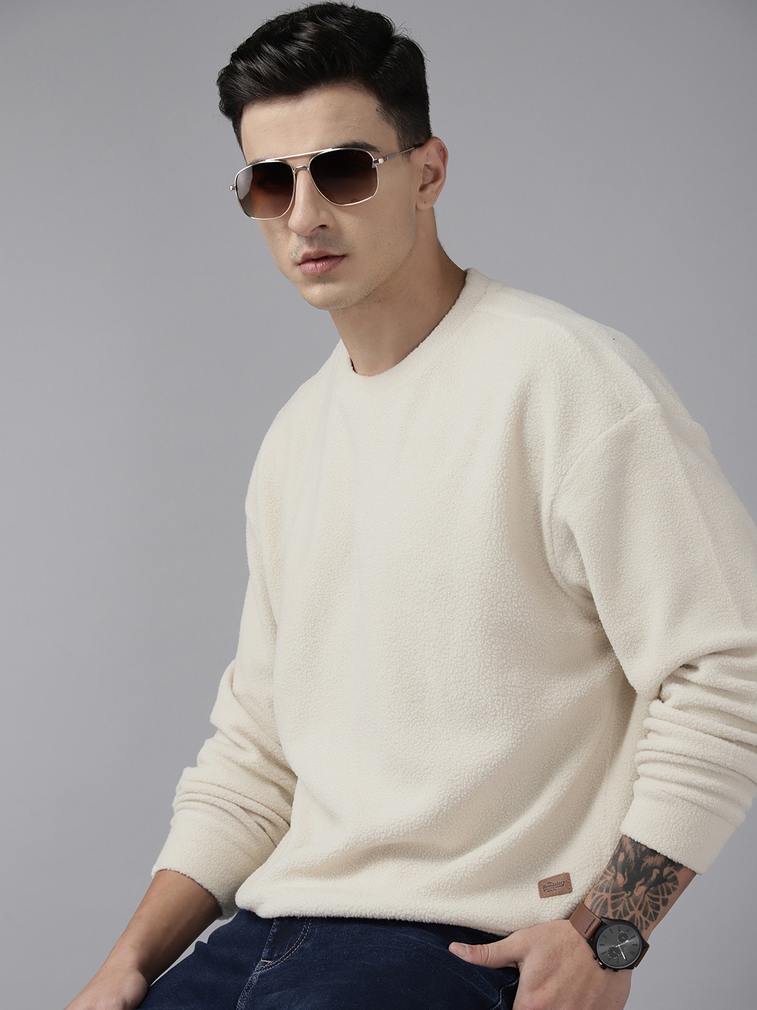 

Roadster Men Solid Sweatshirt, Off white