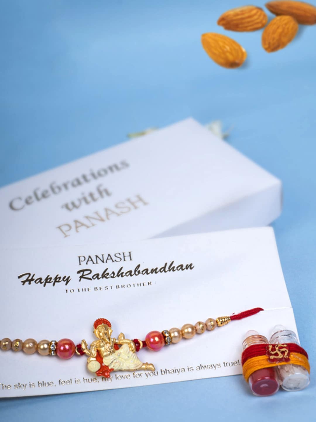 

PANASH Men Gold-Plated Ganesh Ji Thread Rakhi with Roli Chawal Gift Set