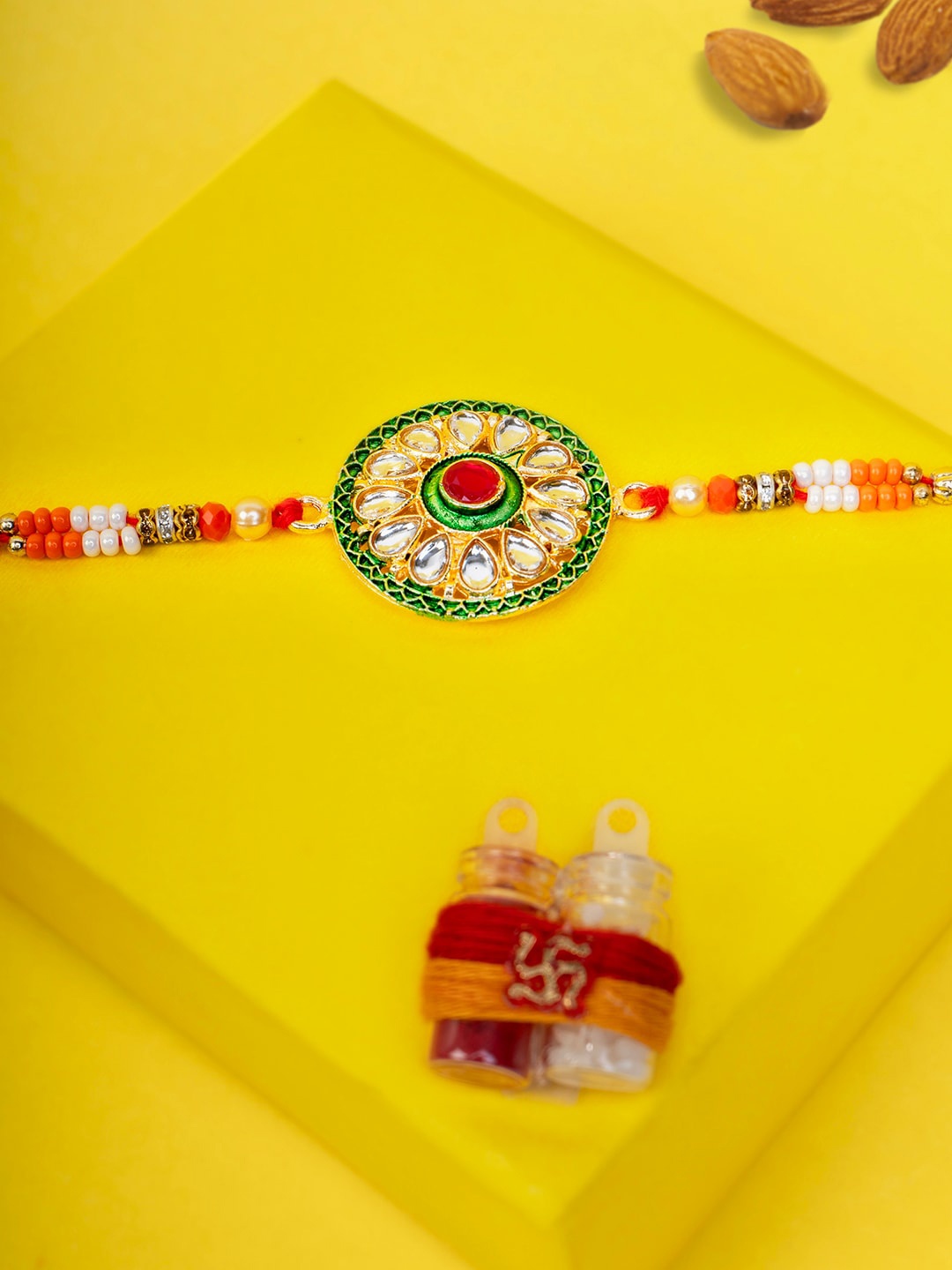 

PANASH Gold-Plated Circular-Shaped Kundan Thread Rakhi With Roli Chawal