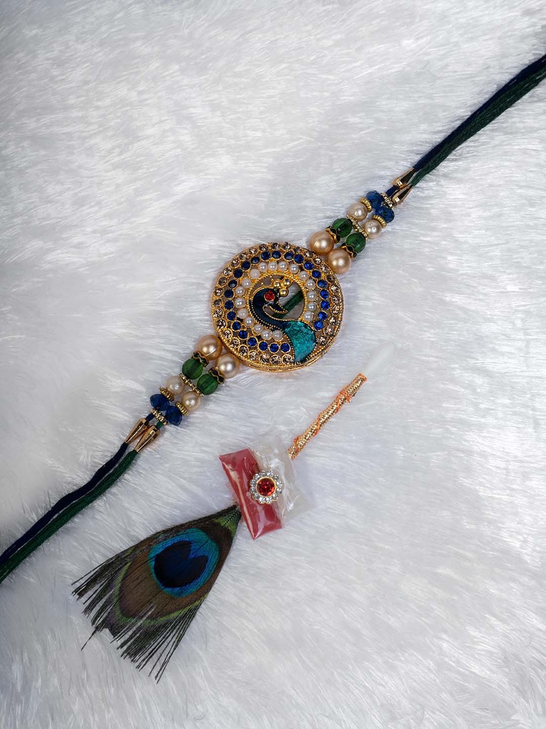 

PANASH Men Gold-Plated Peacock Stone-Studded Thread Rakhi With Mor Pankh Stick Roli Chawal