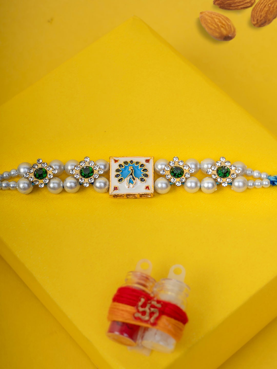 

PANASH Gold-Plated Square Shaped Pearl Thread Rakhi With Roli Chawal Gift Set