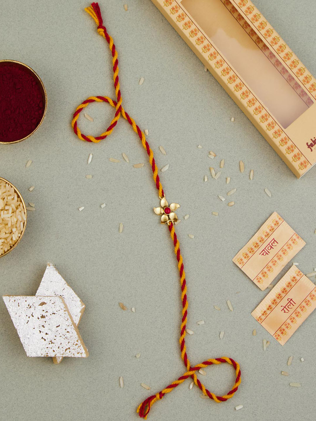 

Fabindia Unisex Gold-Plated Rakhi With Roli & Chawal