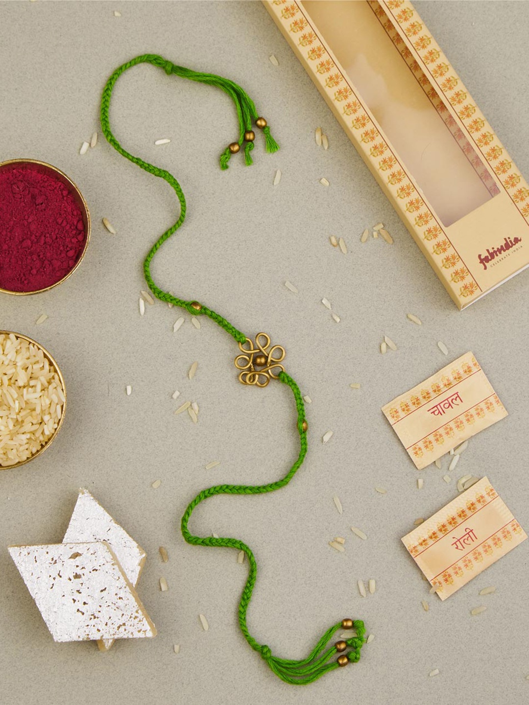 

Fabindia Charm Thread Rakhi With Roli & Chawal, Green