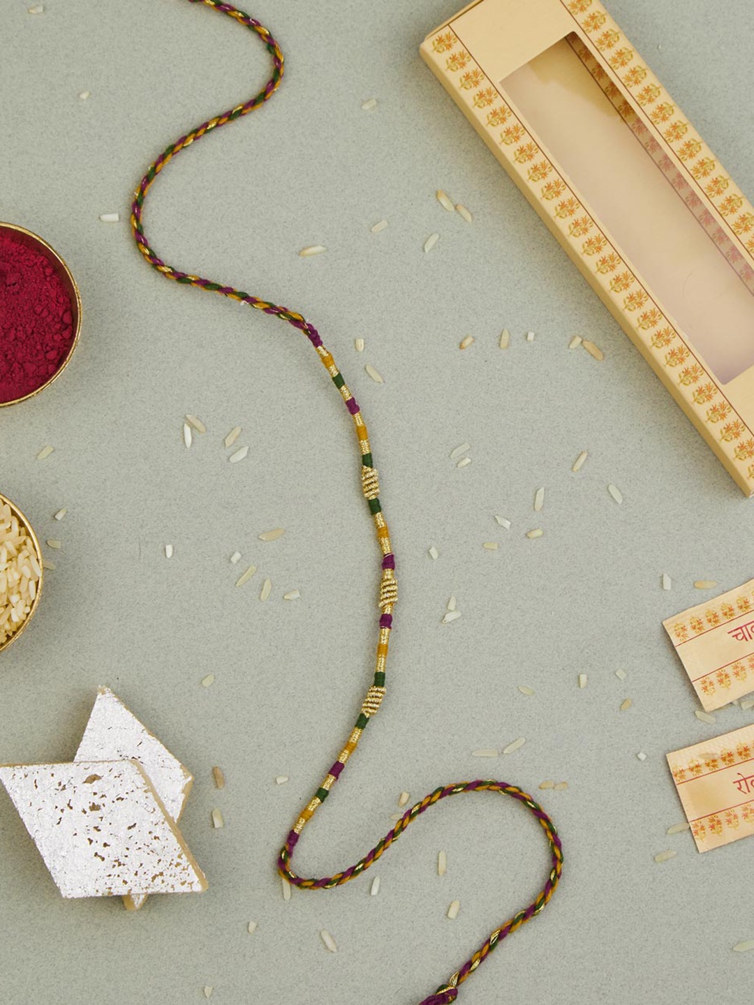 

Fabindia Gold-Plated Zari Thread Rakhi With Roli & Chawal