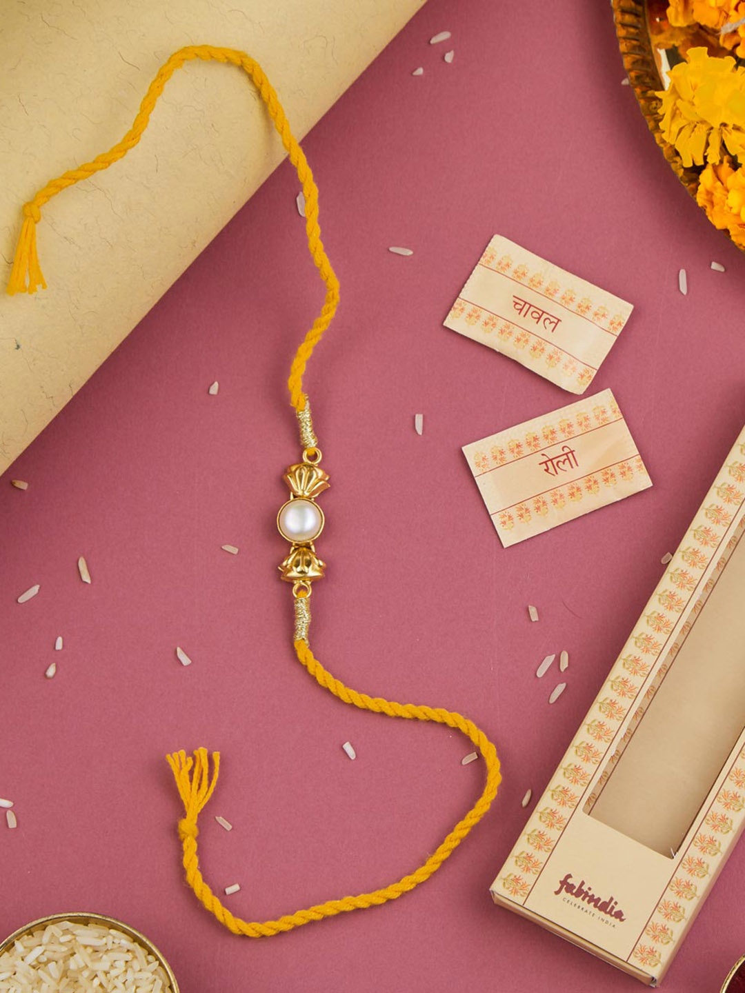 

Fabindia Gold-Plated Pearl Rakhi With Roli & Chawal