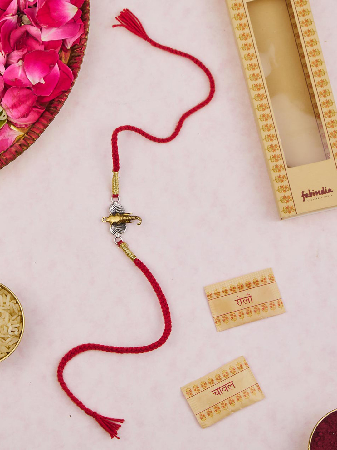 

Fabindia Two Tone Silver Elephant Charm Thread Rakhi With Roli Chawl, Gold
