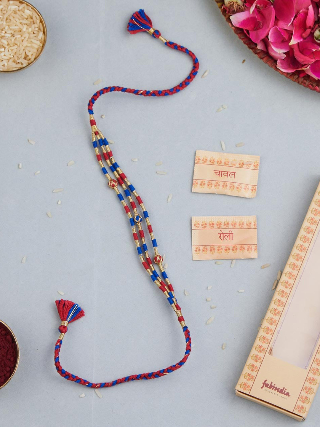 

Fabindia Gold-Plated Zari Thread Rakhi With Roli & Chawal