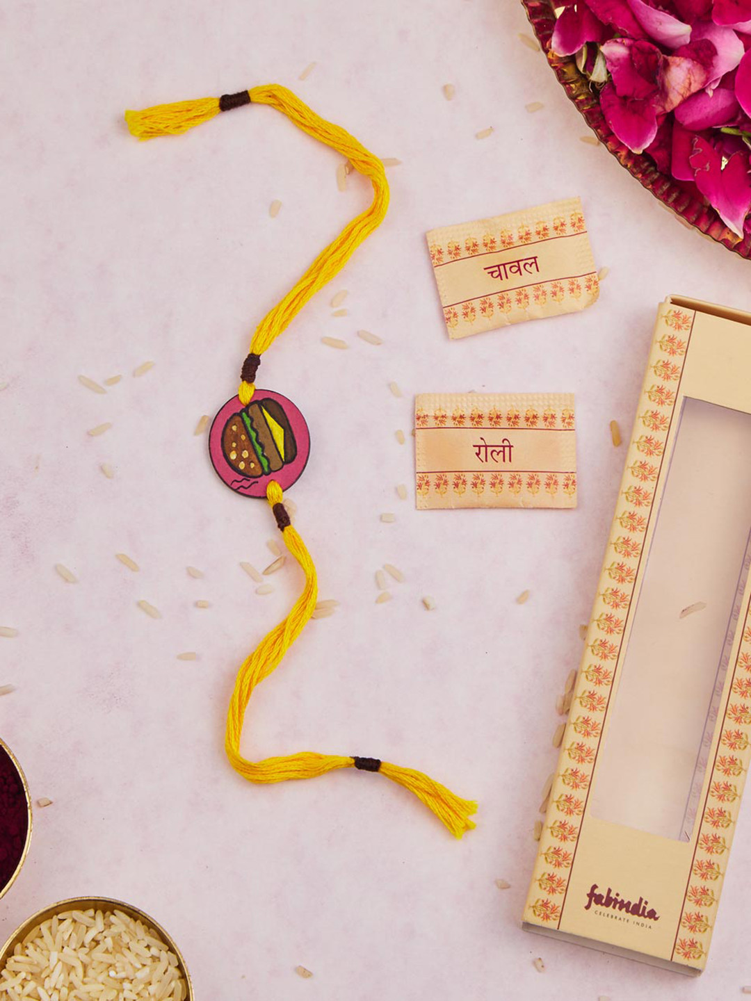 

Fabindia Kids Wooden Thread Rakhi With Roli Chawl Pack, Pink