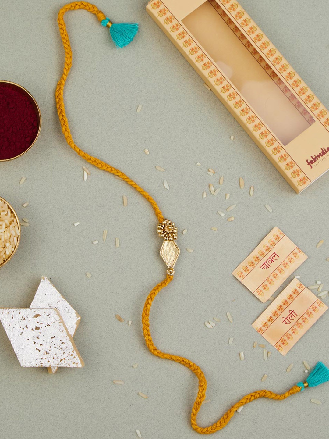 

Fabindia Unisex Stone Studded Thread Rakhi With Roli & Chawal, Gold