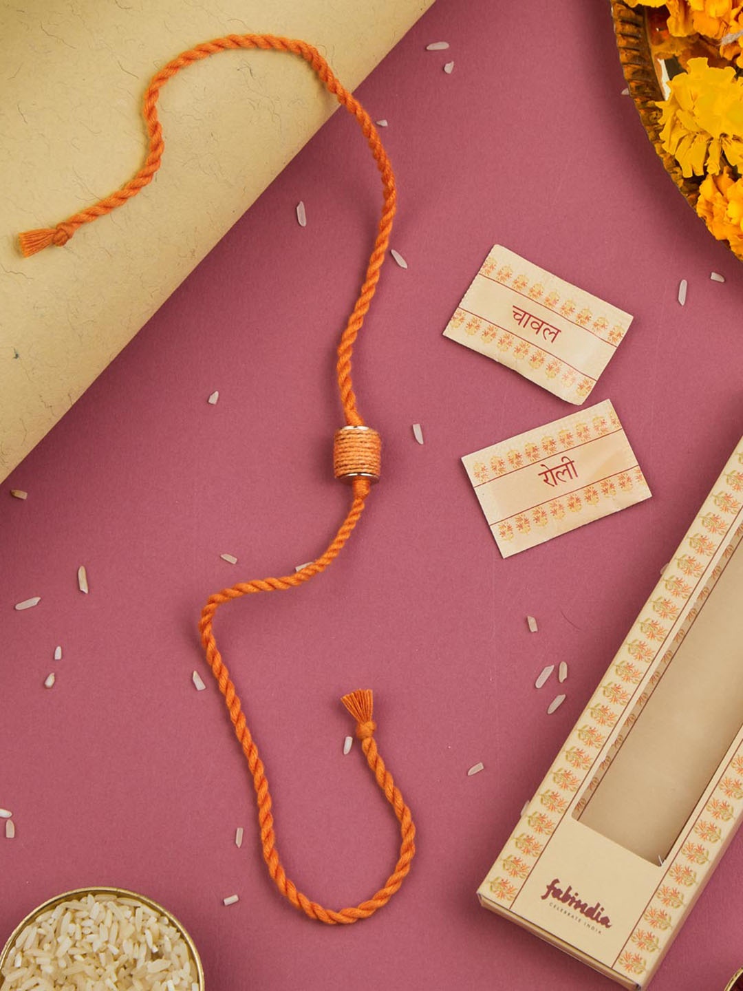 

Fabindia Thread Rakhi With Roli Chawl Pack, Orange