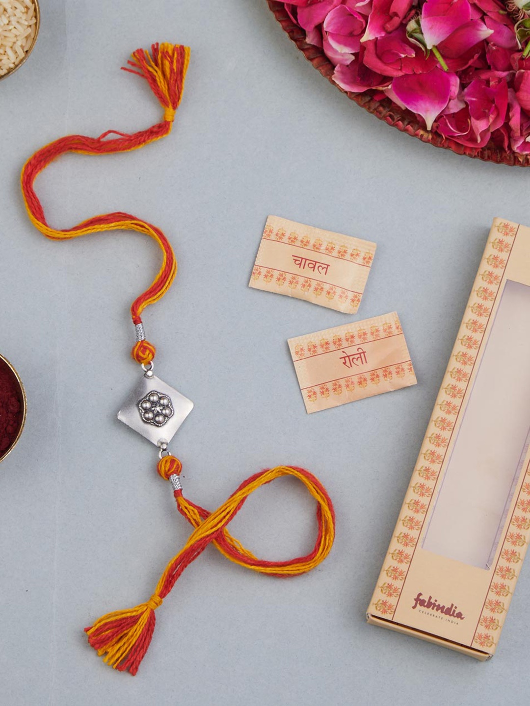 

Fabindia Unisex Silver Artificial Stones Patra Rakhi With Roli & Chawal