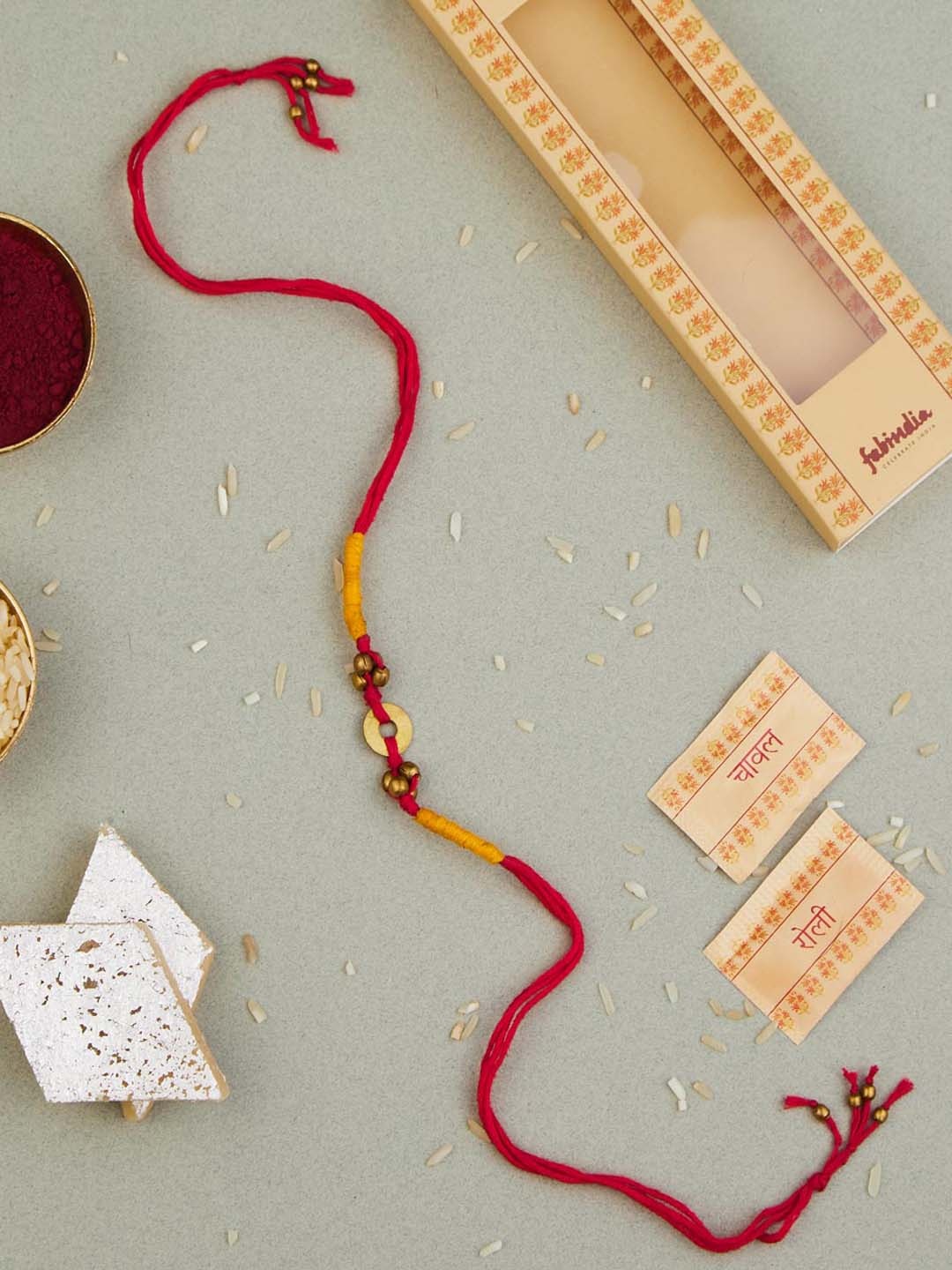 

Fabindia Unisex Charm Thread Rakhi With Roli & Chawal, Gold