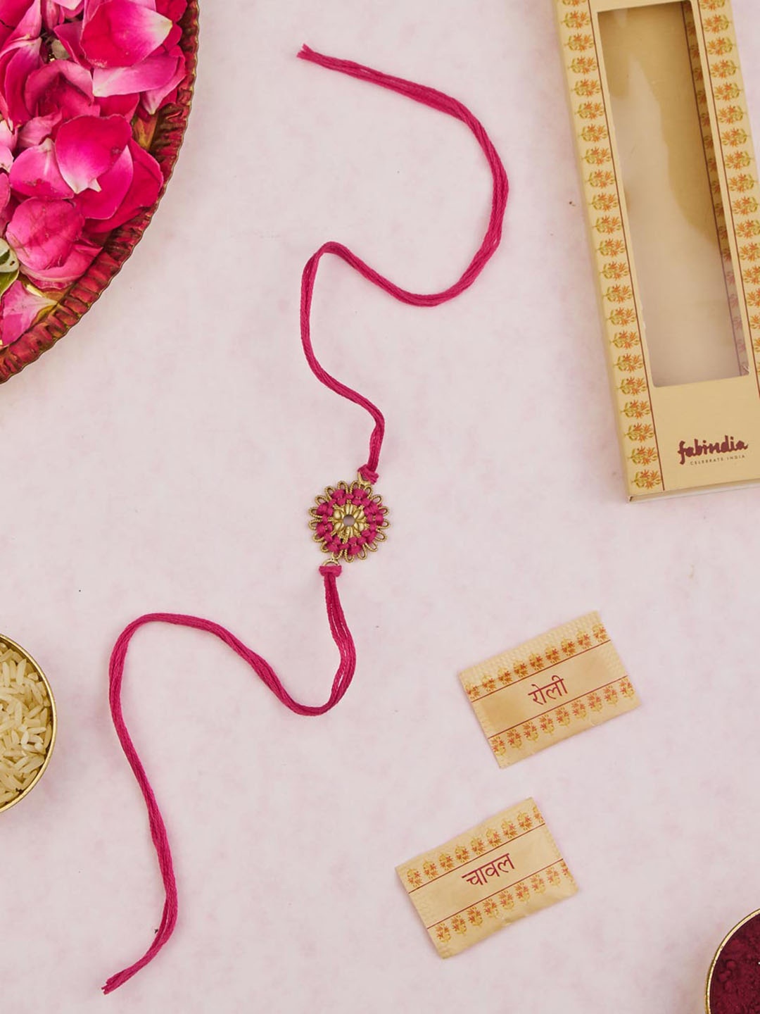 

Fabindia Unisex Flower Thread Rakhi With Roli Chawl Pack, Pink