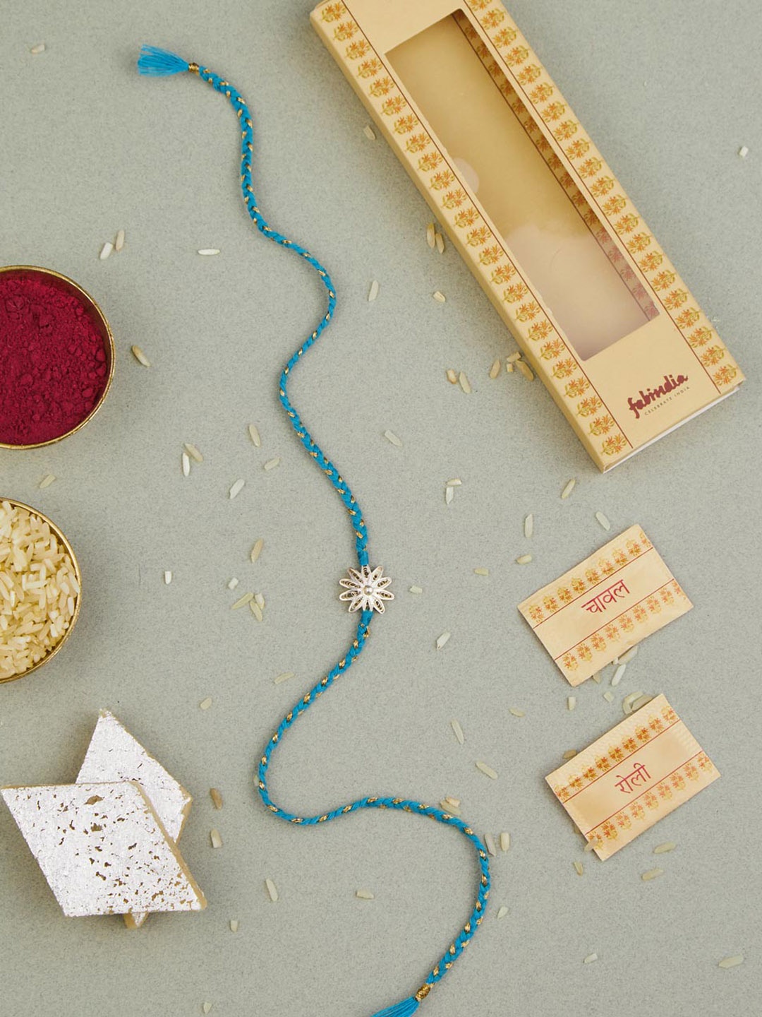 

Fabindia Unisex Silver Flower Filigree Rakhi With Roli & Chawal