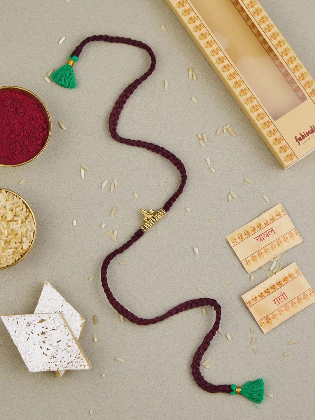 

Fabindia Unisex Bead Rakhi With Roli Chawl Pack, Gold