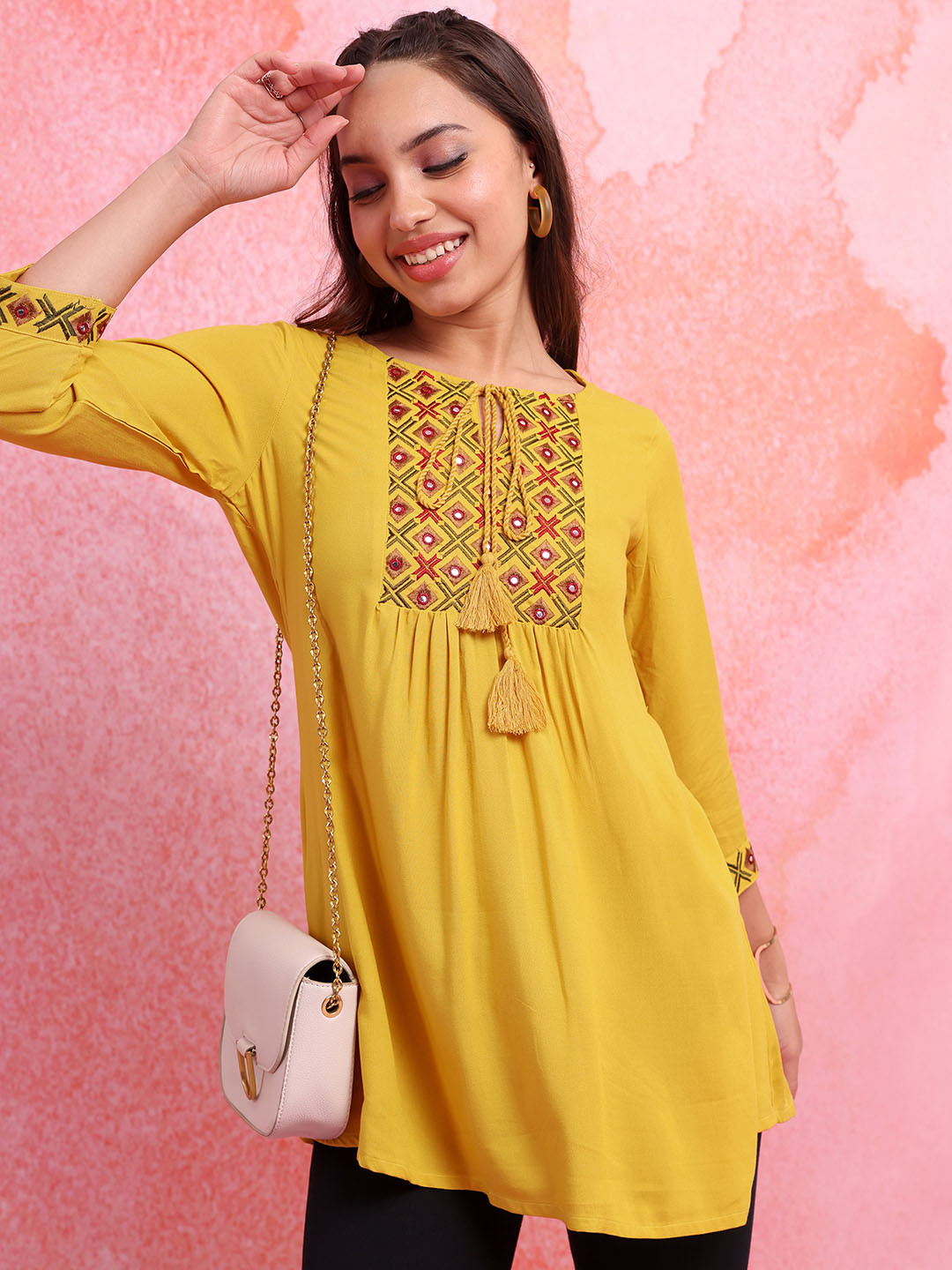 

Vishudh Floral Embroidered Tie-Up Neck A-line Top, Mustard