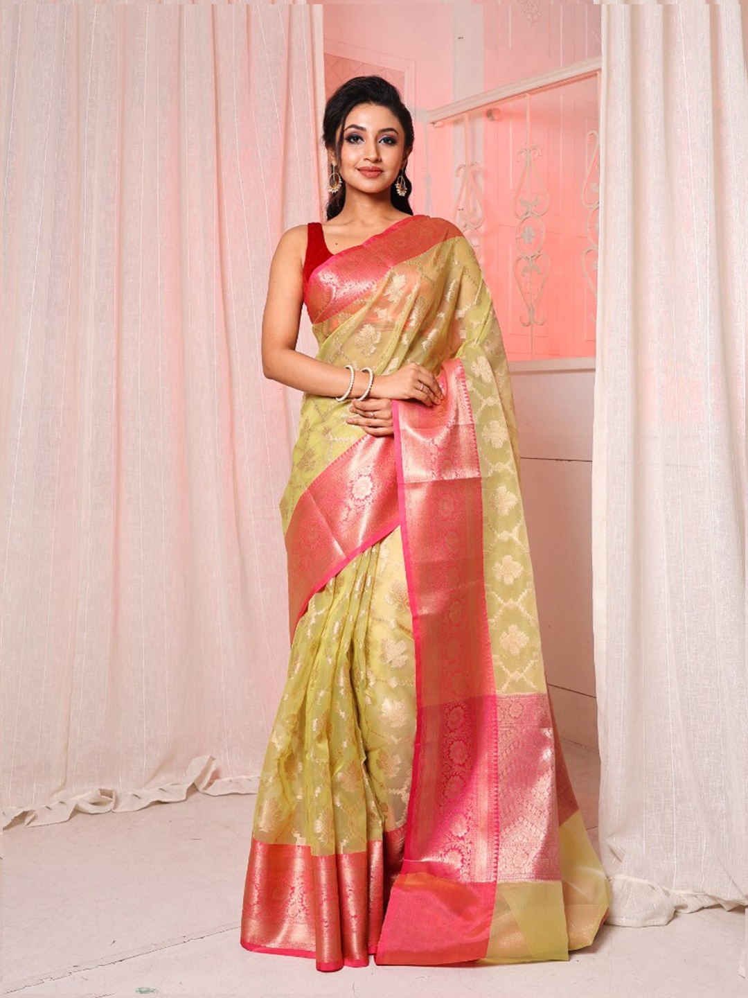 

Arhi Ethnic Motifs Woven Design Zari Organza Saree, Green
