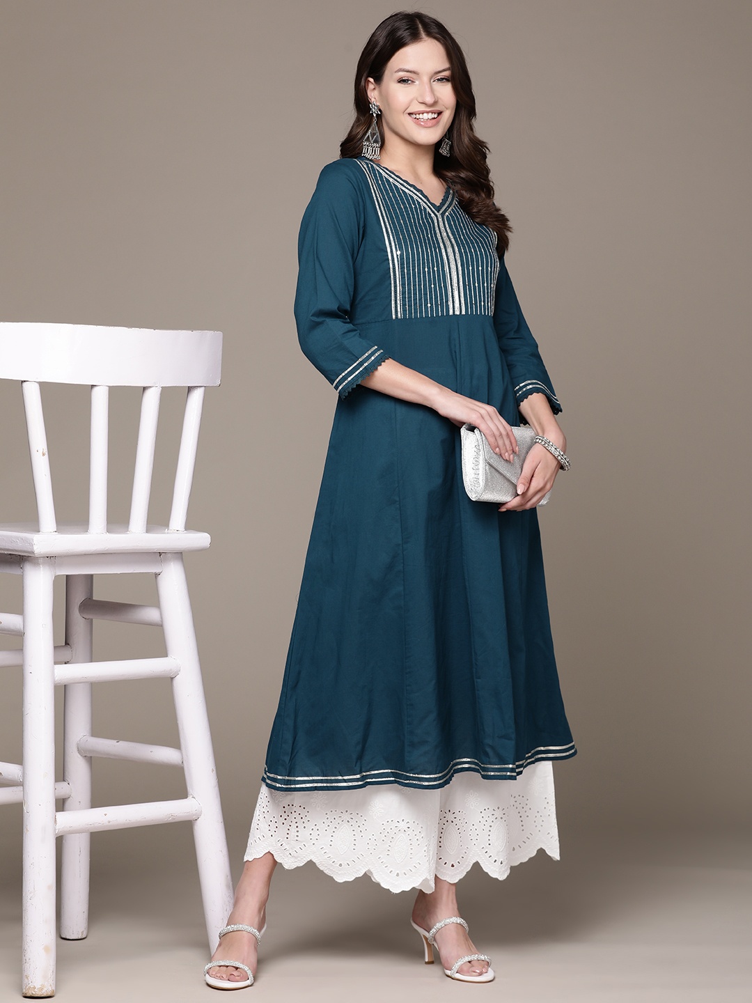 

Ishin Women Teal Woven Yoke Design Sequinned Kurta
