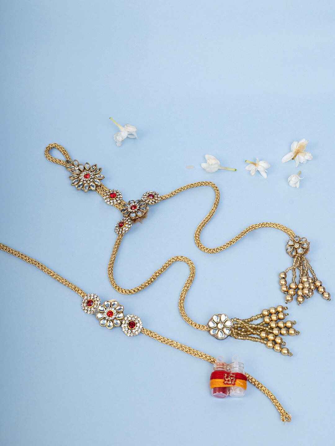 

PANASH Set Of 4 Gold-Plated Kundan Rakhi With Radha Krishna & Roli Chawal