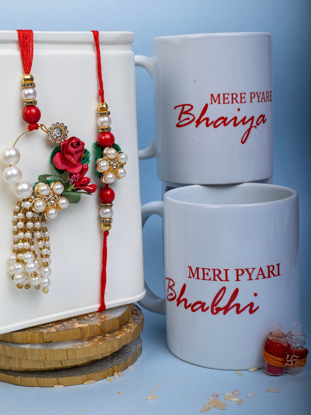 

PANASH Set Of 3 Gold-Plated Floral pearl Rakhi With Mug & Roli Chawal