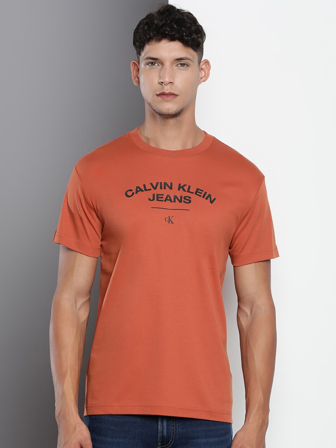 

Calvin Klein Jeans Typography Printed Slim Fit Pure Cotton T-shirt, Rust