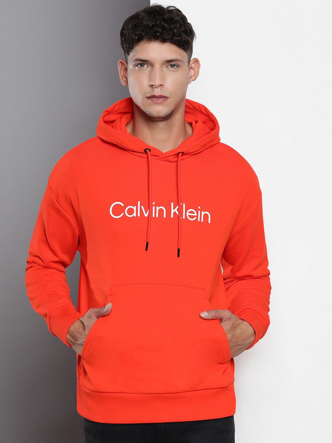 

Calvin Klein Jeans Typography Printed Hooded Cotton Sweatshirt, Orange