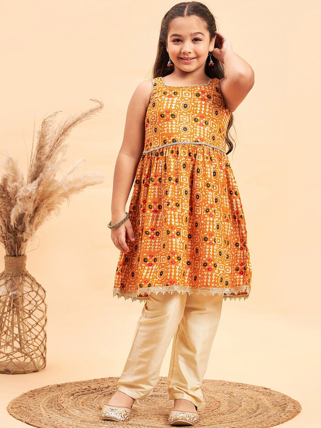 

Stylo Bug Girls Ethnic Motifs Printed Regular Kurta With Trousers, Yellow
