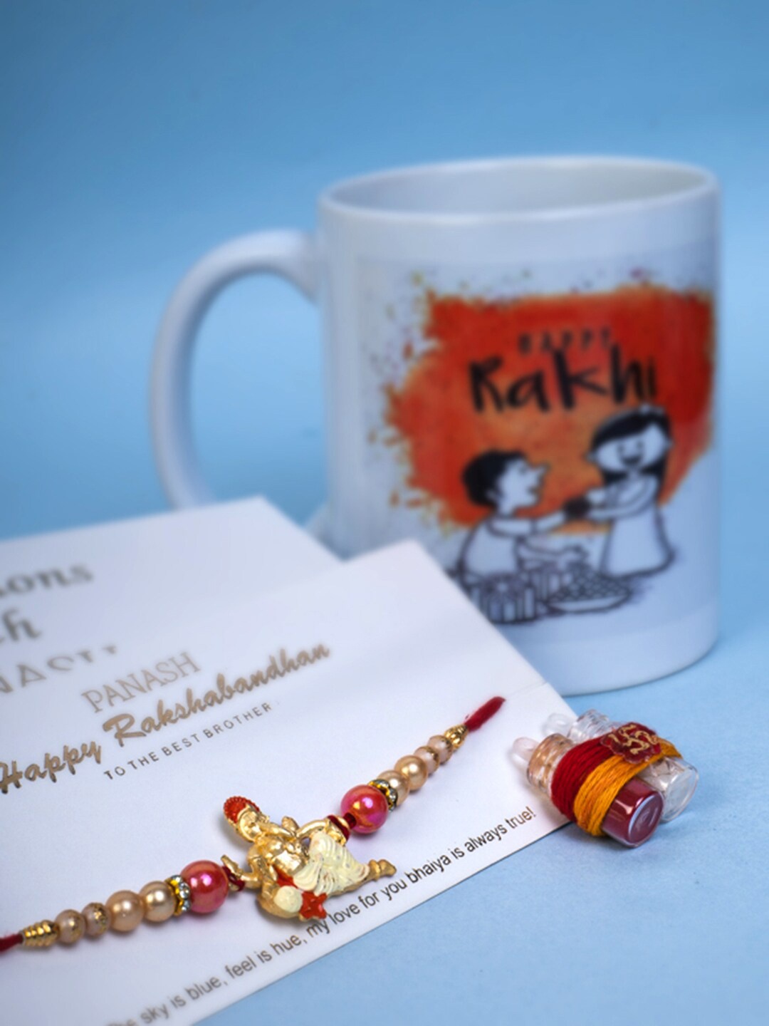 

PANASH Men Gold-Plated Rakhi With Mug & Roli Chawal