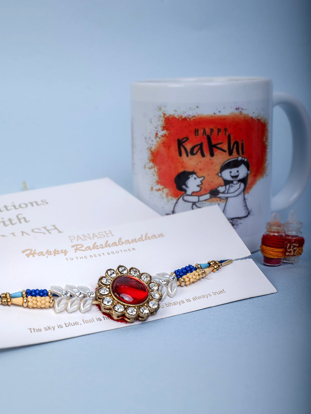 

PANASH Gold-Plated Stone-Studded Rakhi With Roli Chawal & Mug Gift Set