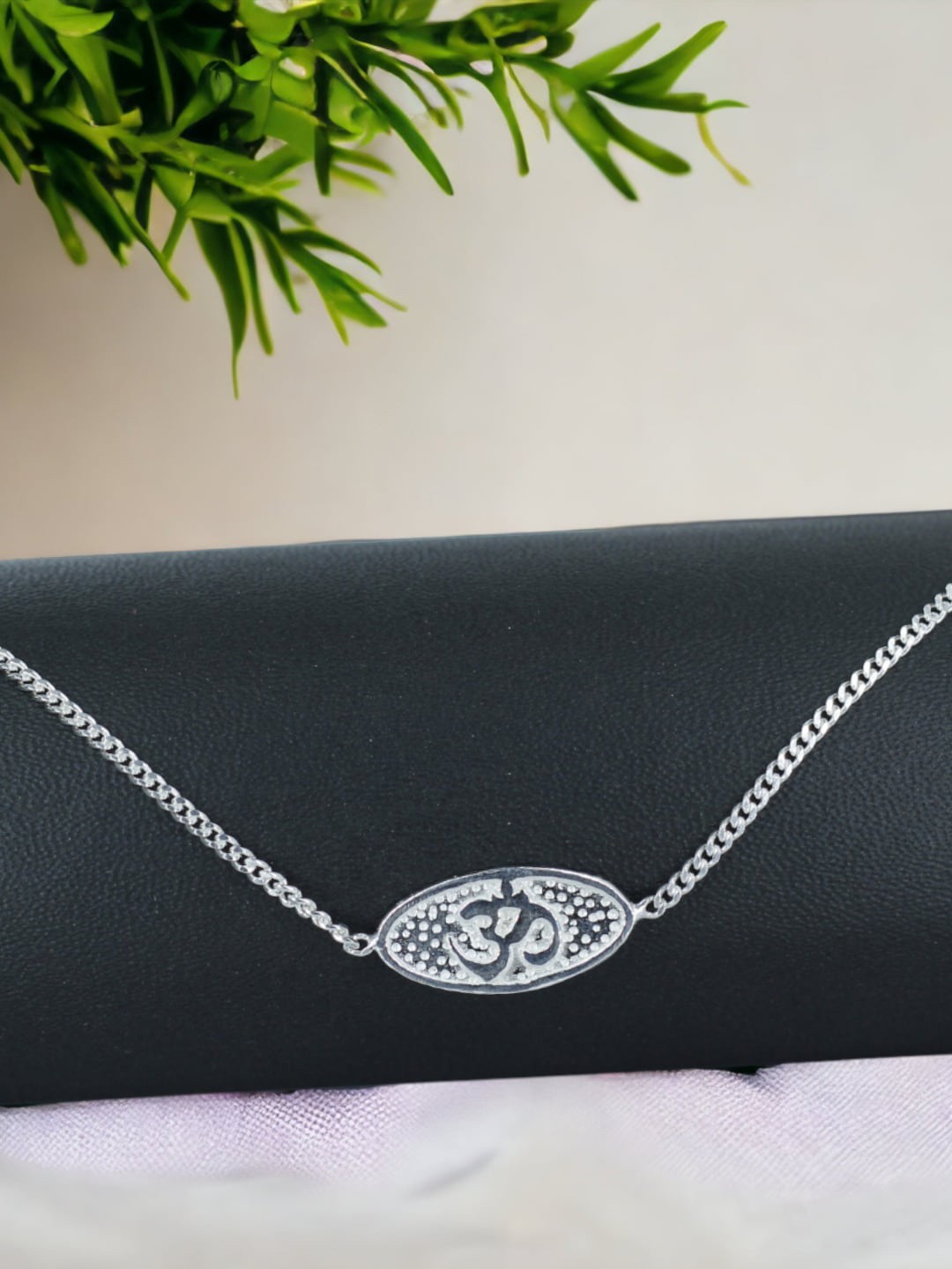 

Taraash 92.5 Sterling Silver Om Charm Rakhi