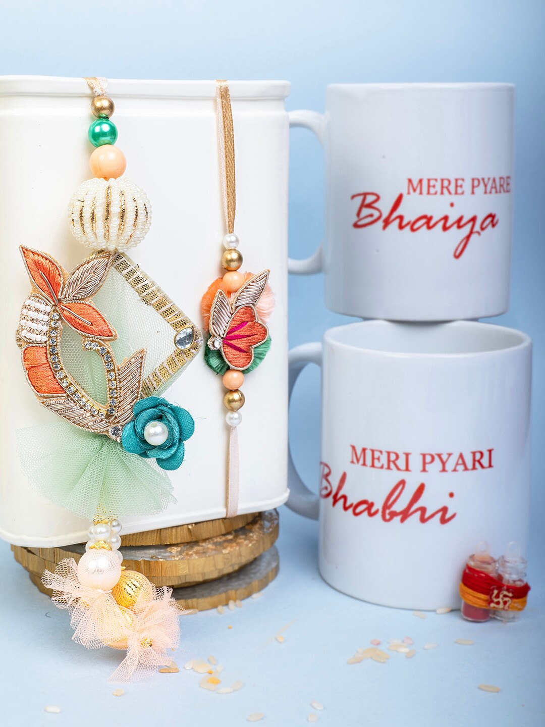 

PANASH Set Of 2 Bhaiya Bhabhi Rakhi With Roli Chawal & Mugs Gift Set, Red