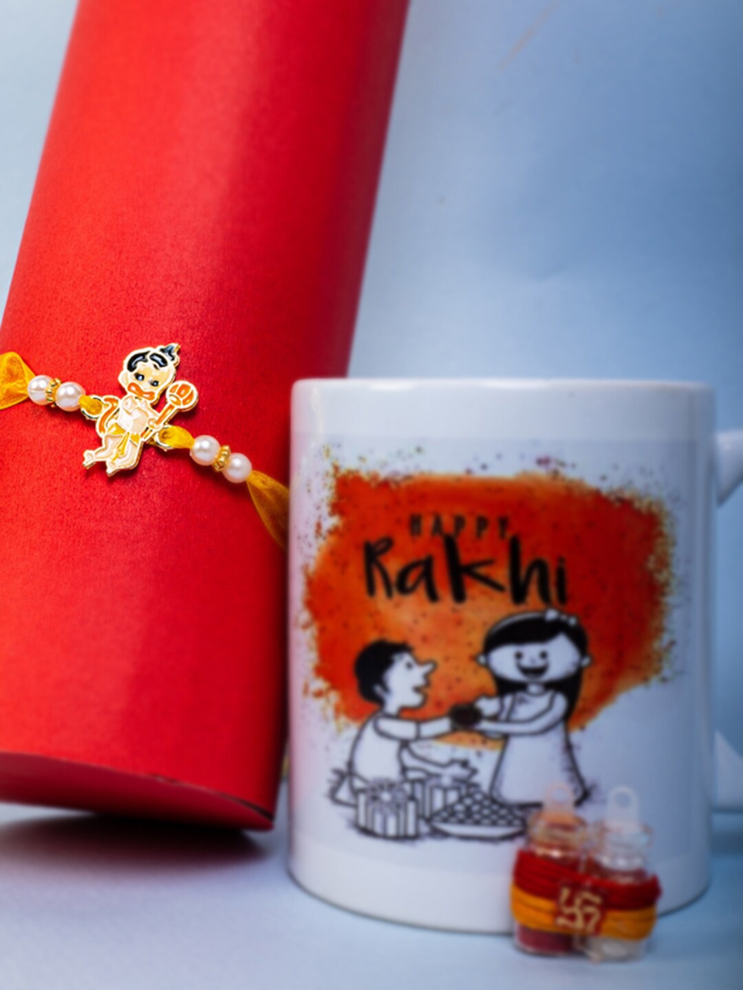

PANASH Gold-Plated Little Hanuman Charm Rakhi With Mug & Roli Chawal