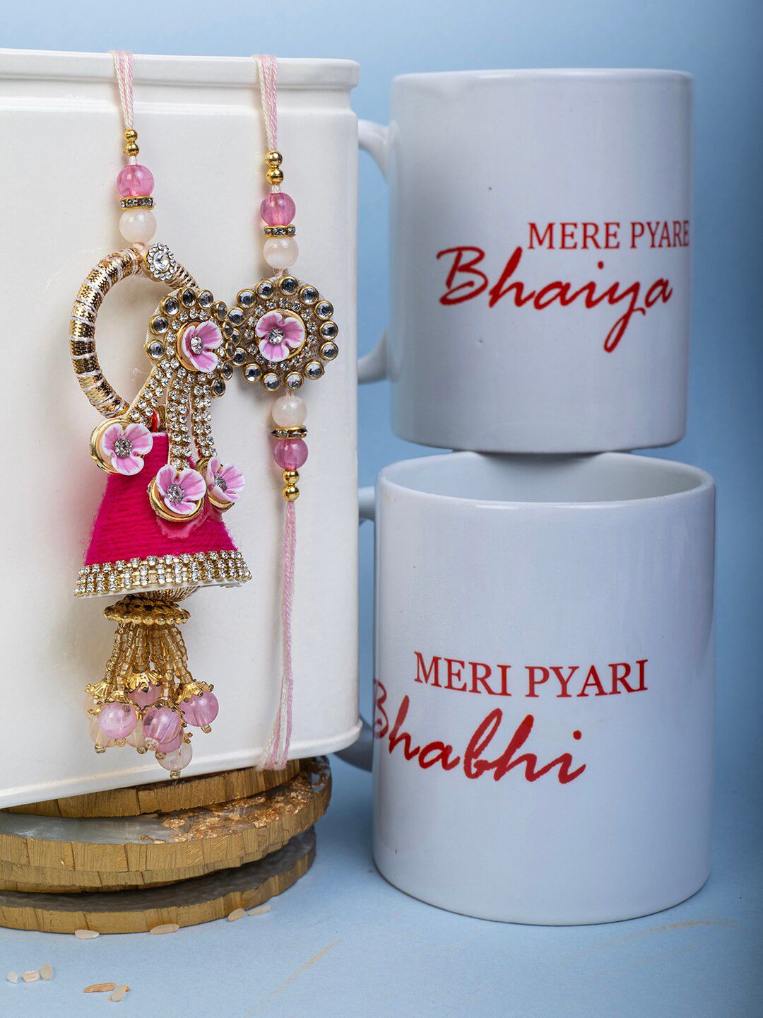 

PANASH Set Of 2 Gold Plated Rakhi with Two Mug Roli & Rice