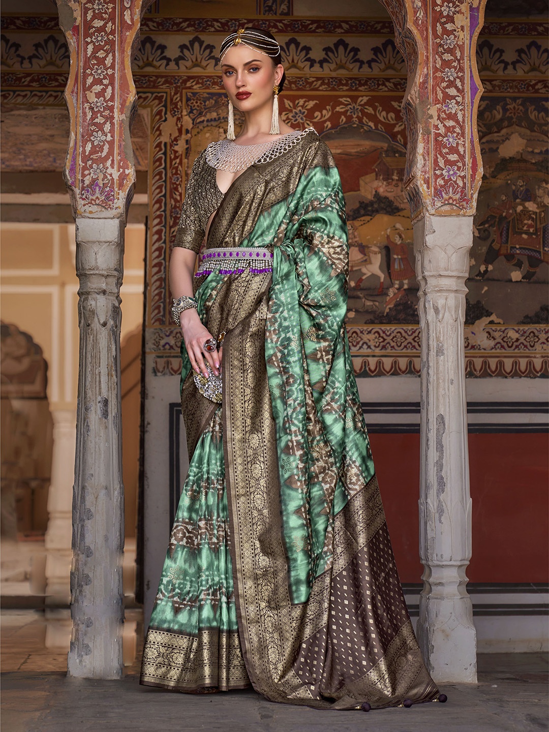 

Mitera Sea Green & Brown Ethnic Motifs Printed Zari Patola Saree