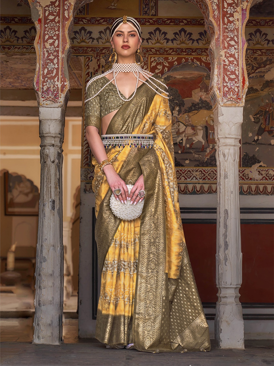 

Mitera Mustard & Brown Ethnic Motifs Printed Zari Patola Saree