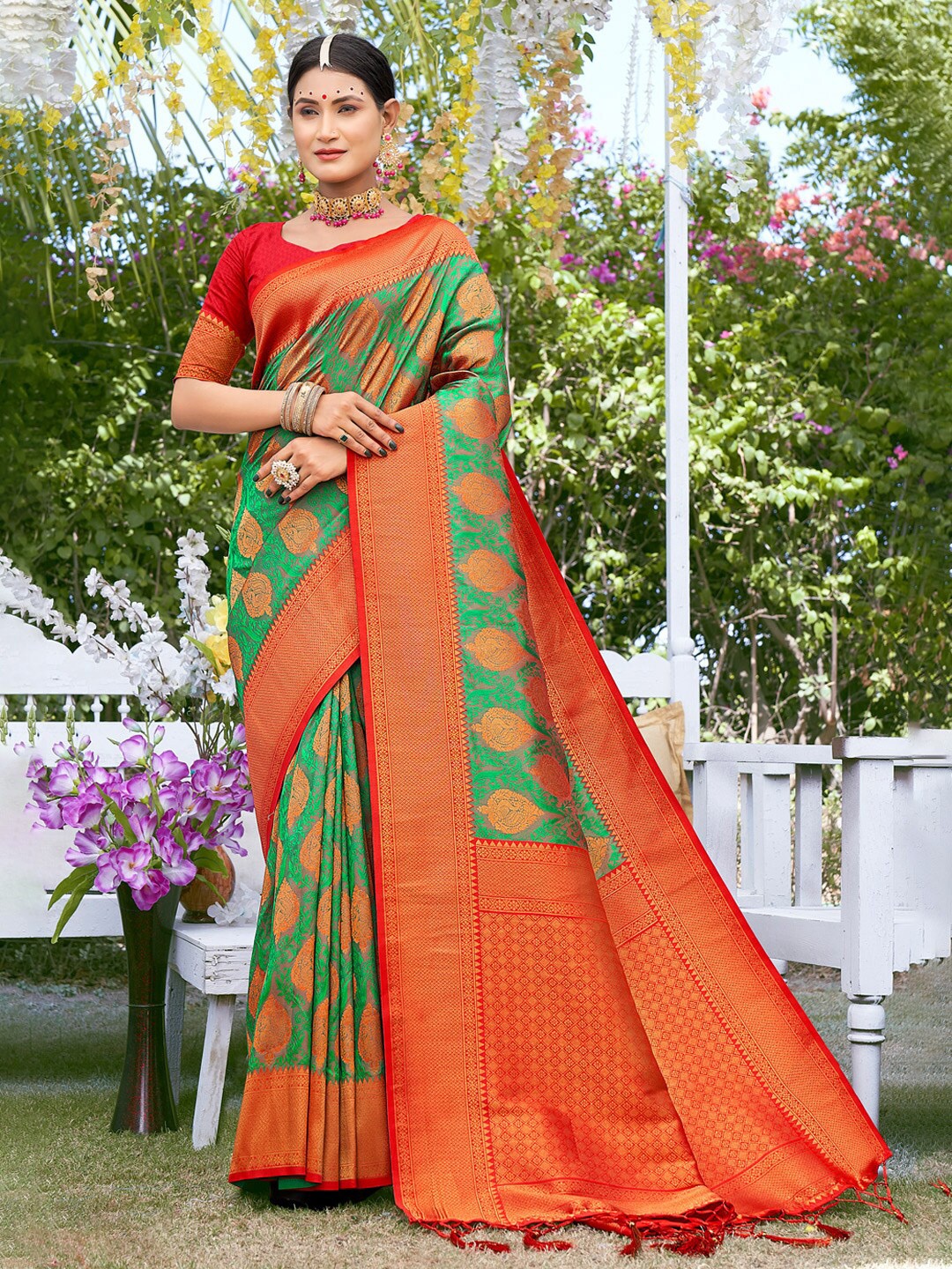 

Mitera Green & Orange Woven Design Zari Silk Blend Saree