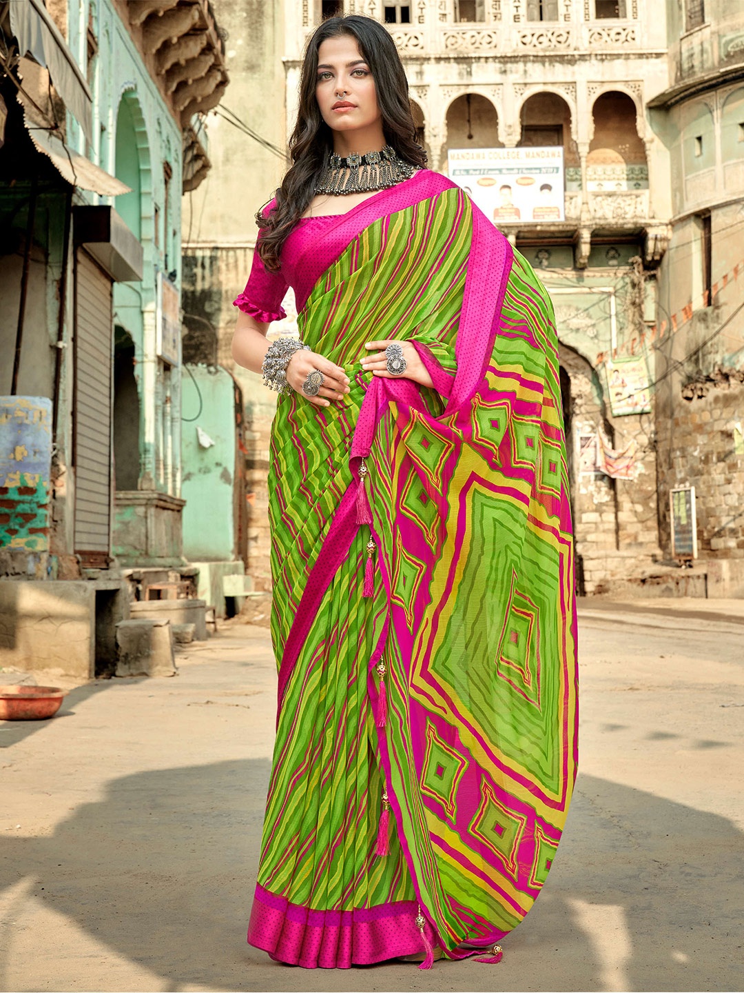

Mitera Green & Pink Leheriya Printed Pure Chiffon Saree