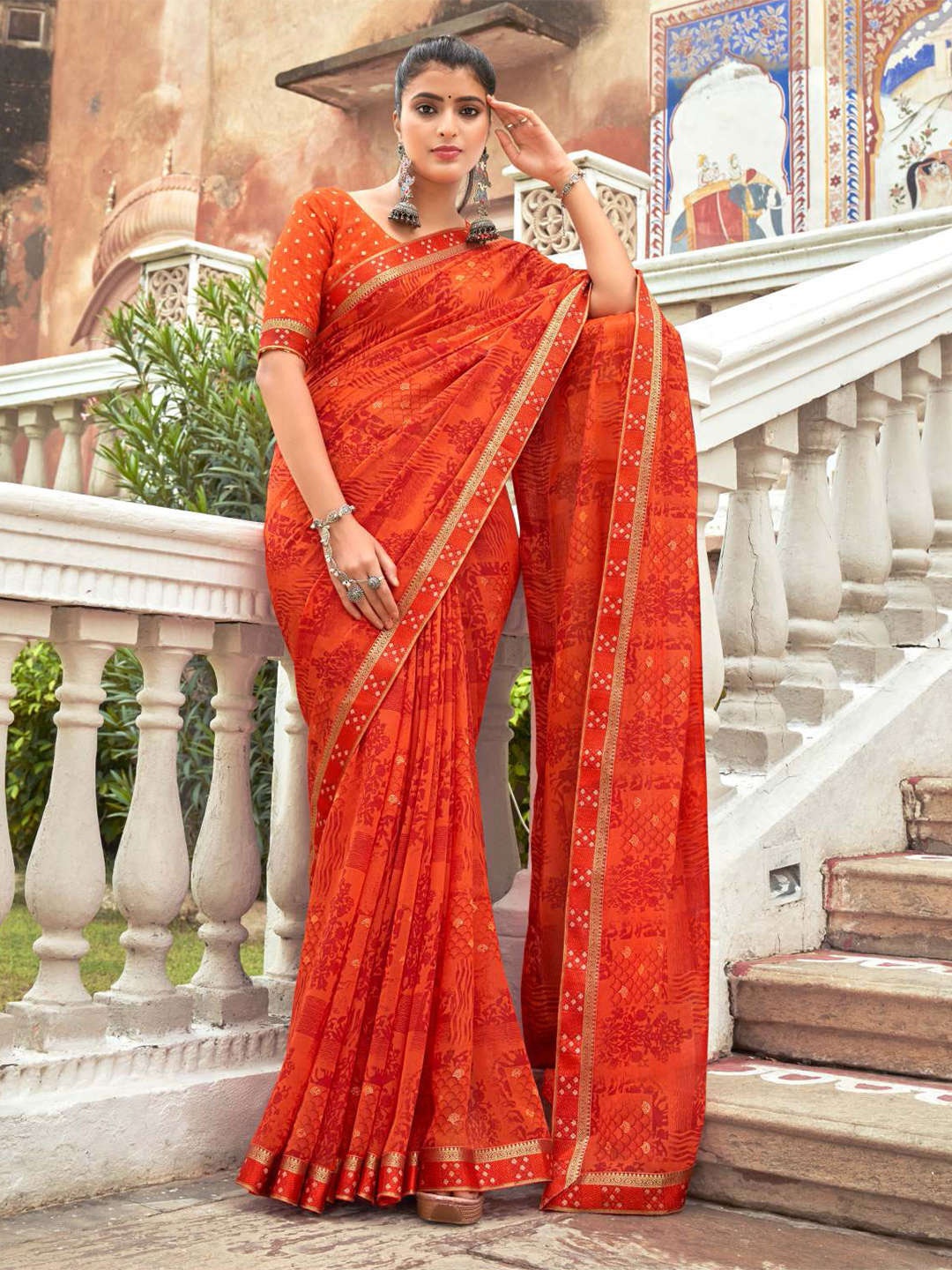 

Mitera Orange & Red Ethnic Motifs Printed Pure Georgette Saree