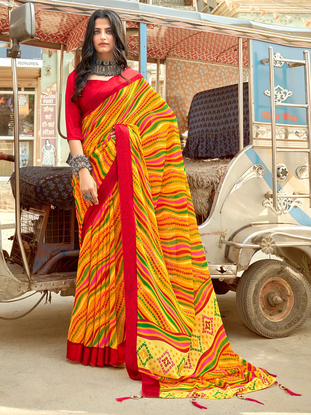 

Mitera Yellow & Green Leheriya Pure Chiffon Saree