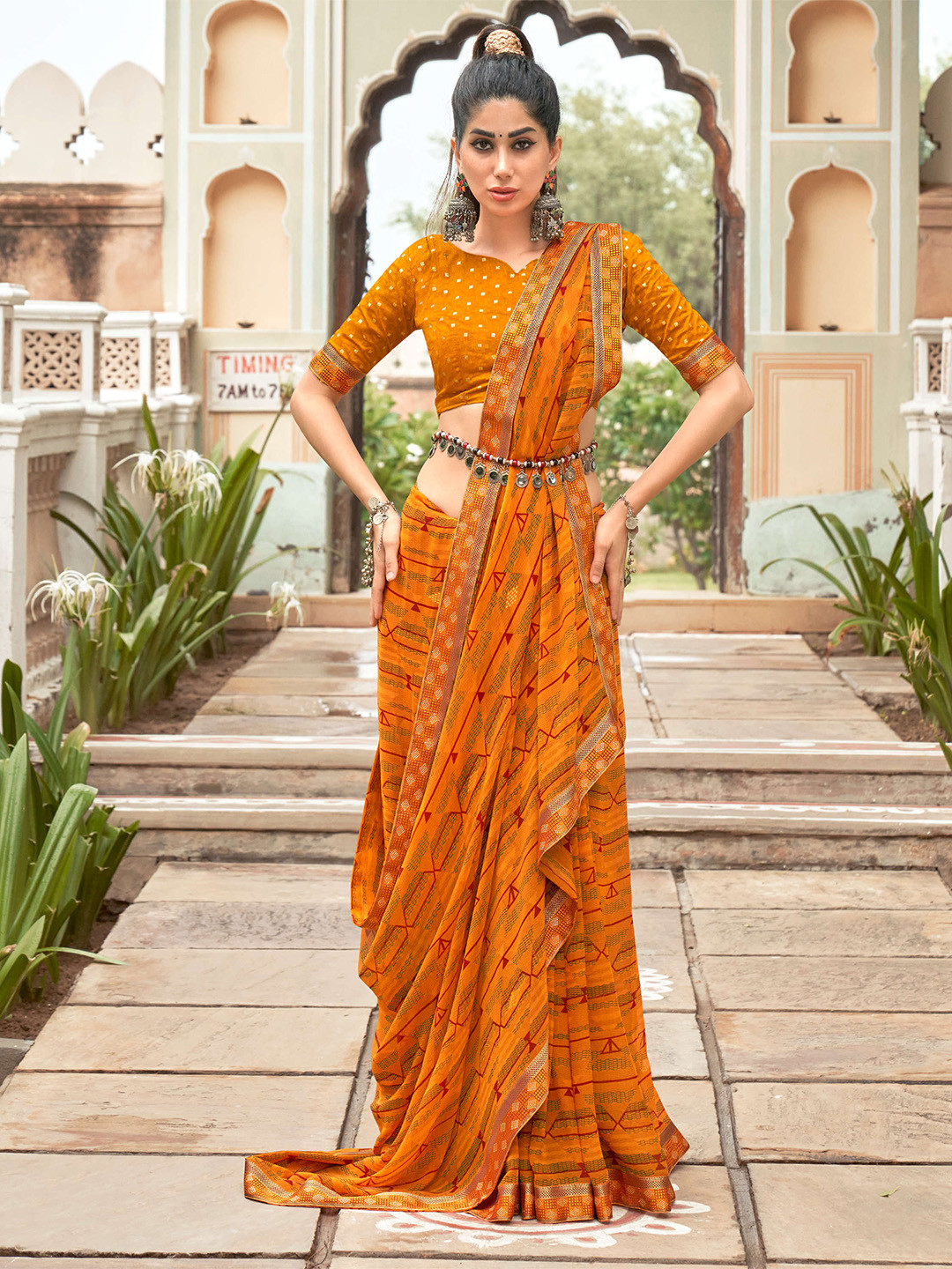 

Mitera Yellow & Green Pure Georgette Saree