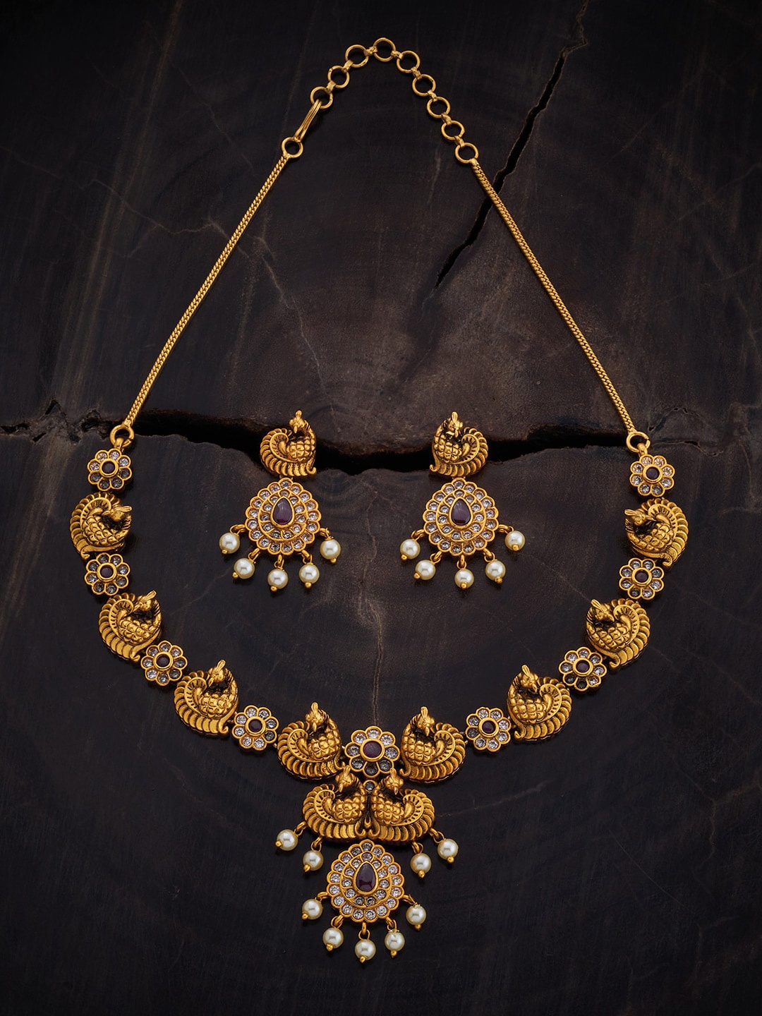 

Kushal's Fashion Jewellery Gold-Plated Stone Studded & Beaded Antique Jewellery Set