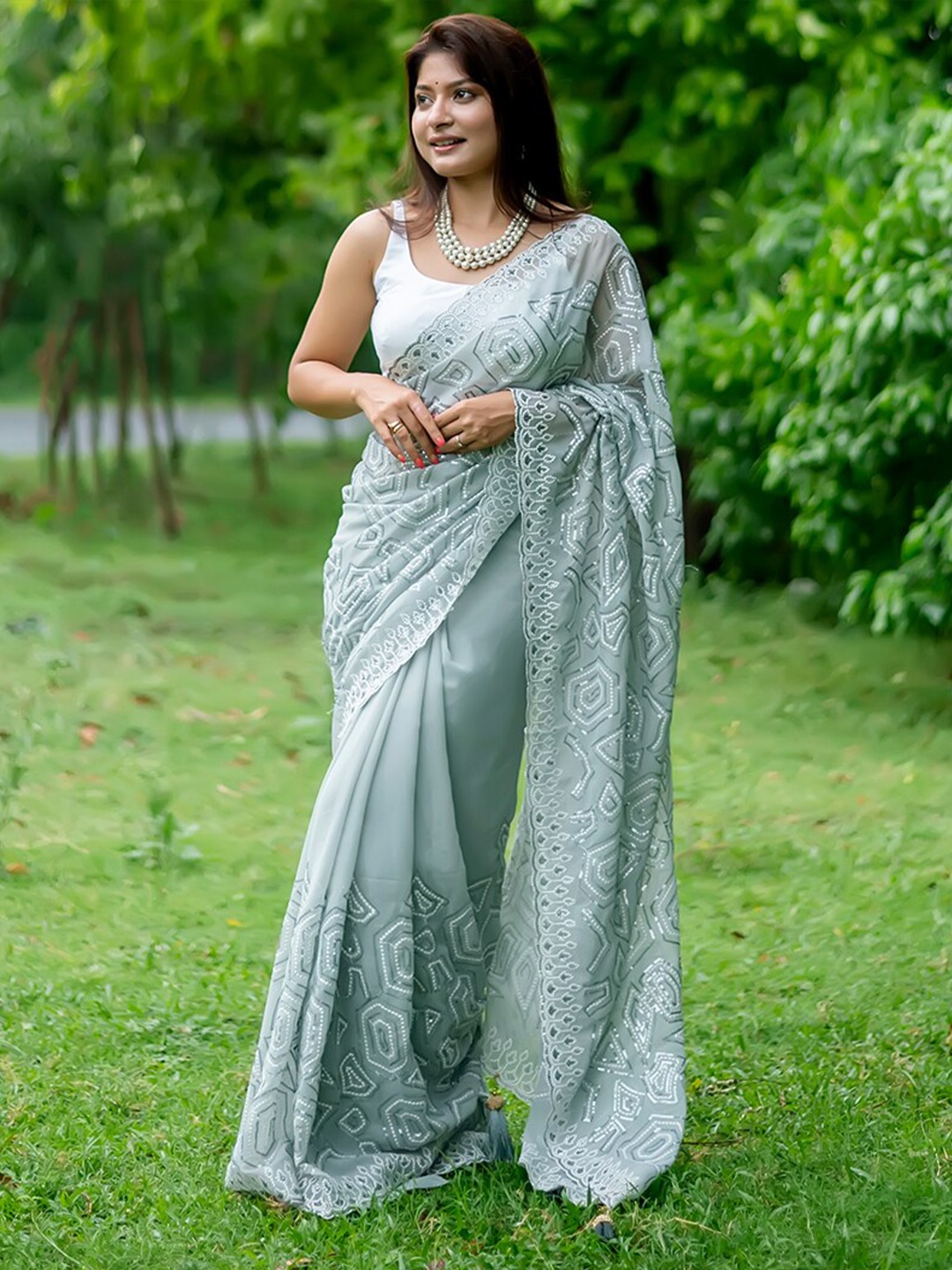 

Anouk Teal Embellished Sequinned Pure Georgette Saree